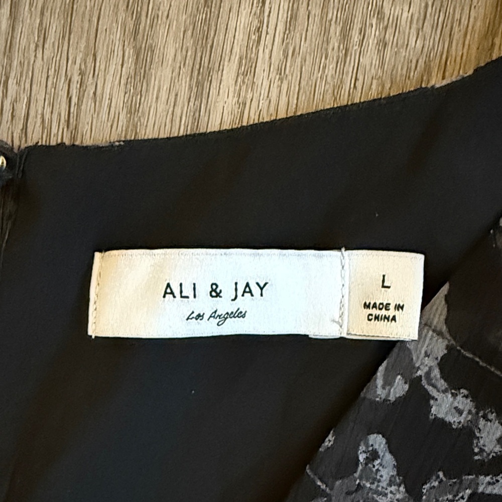 ALI & JAY Black Jumpsuit with Red and Gray Floral Design - Picture 2 of 8